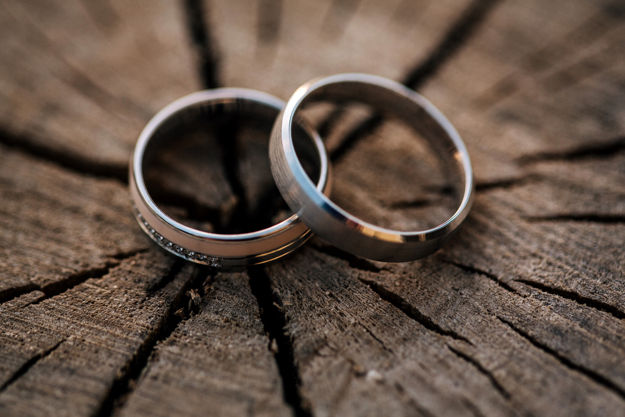 engagement band rings on wooden table