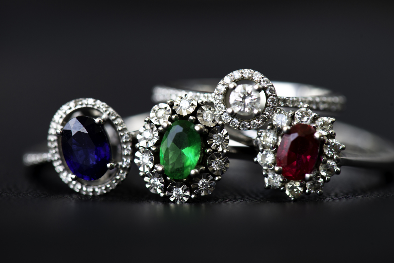 4 rings, blue stone, green stone, diamond, red stone