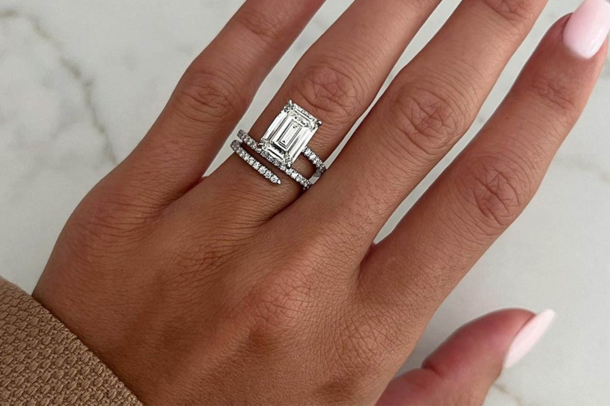 diamond engagement ring on fingers