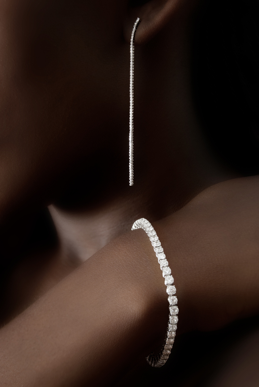 bracelect and earring on person made from small diamonds